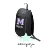 Mochila comunión nombre e inicial colores lila